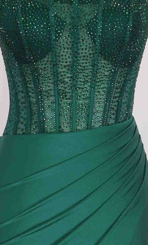 The Long Prom Dress: PromGirl Exclusive 250262 is strapless and emerald green, with a rhinestone corset bodice, sheer beading, and a satin ruched waist detail.
